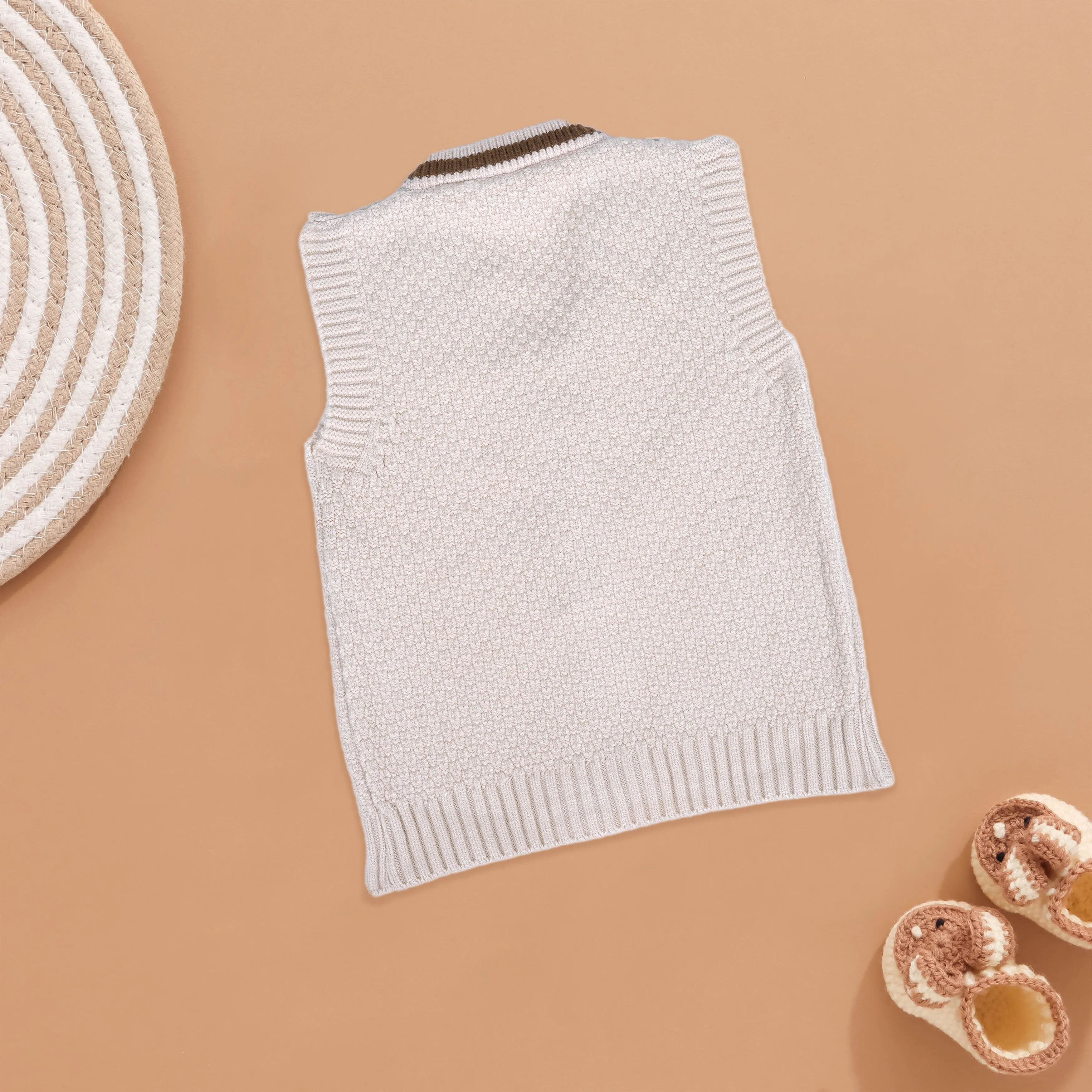 Cool & Cozy: White Knit Vest with Striped Trim for Kids